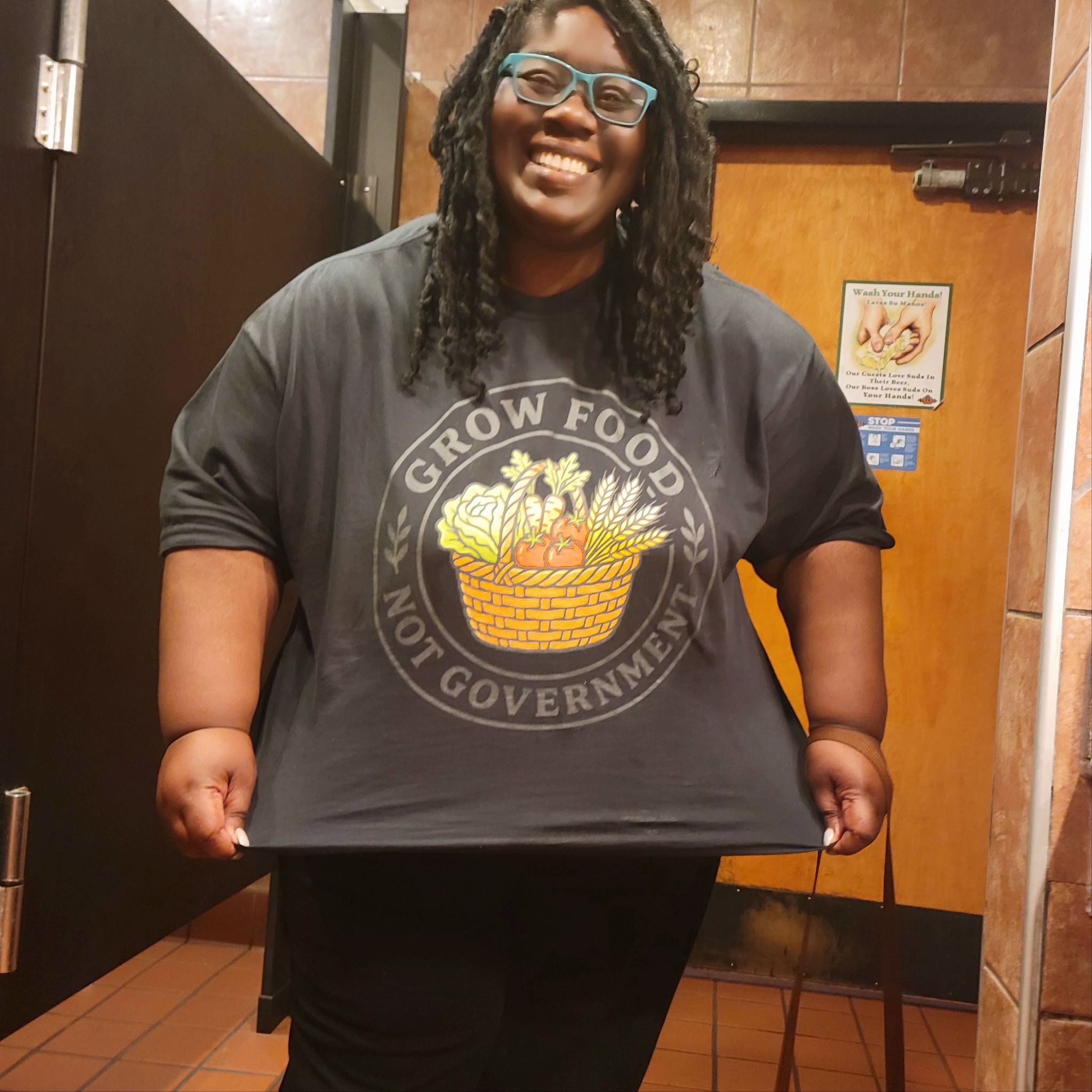 Portia wearing the Grow Food Not Government shirt