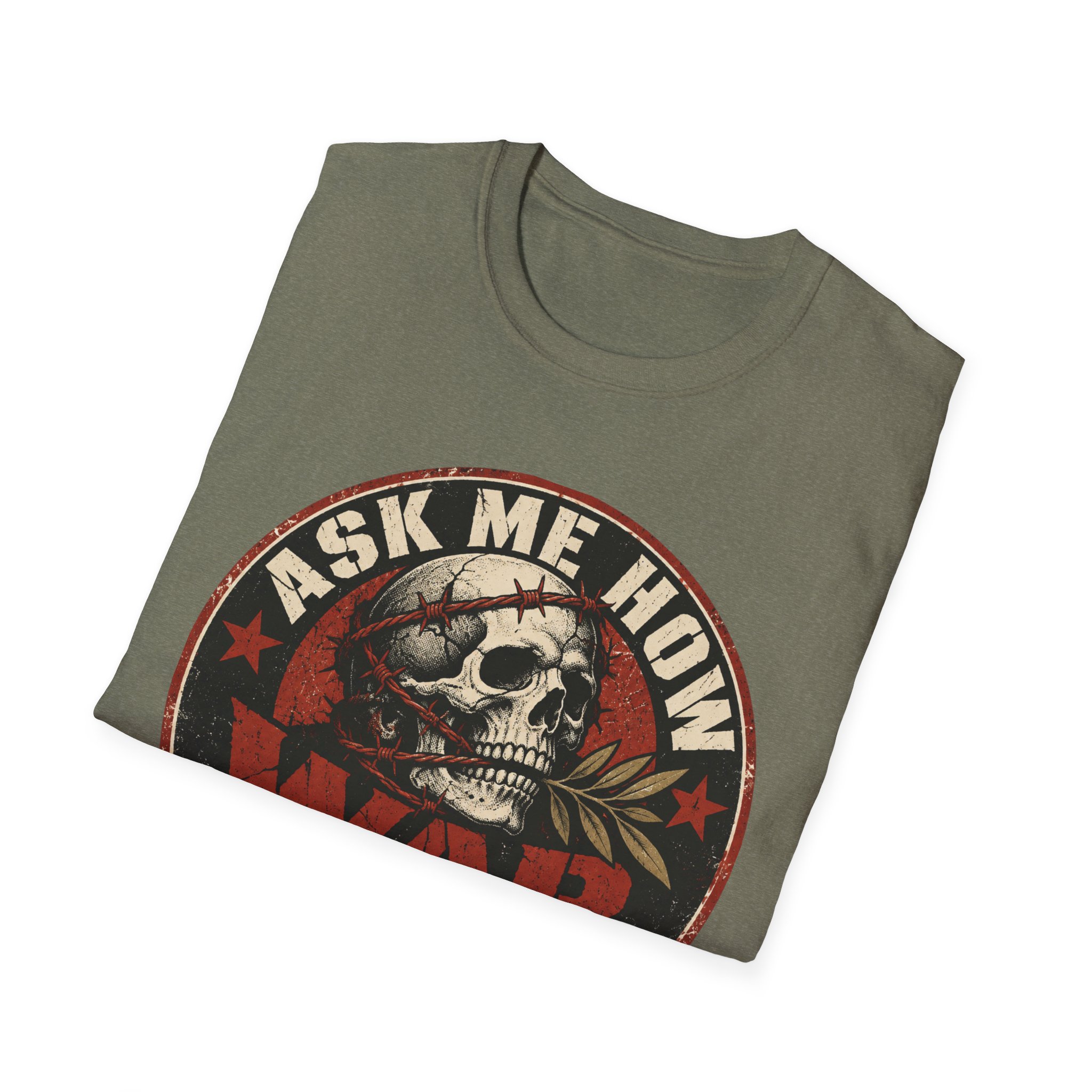 Folded Ask Me How War Is the Health of the State skull tee in Heather Military Green showing the badge print up close.